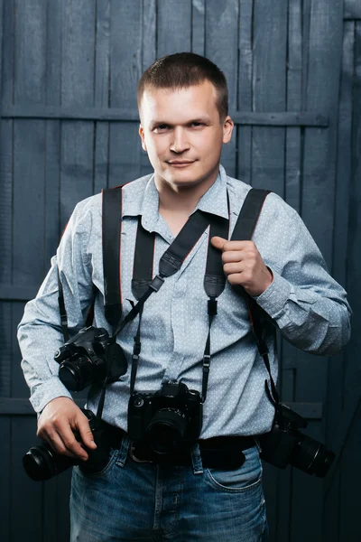 Photographer man with journalist cameras — Stock Photo, Image