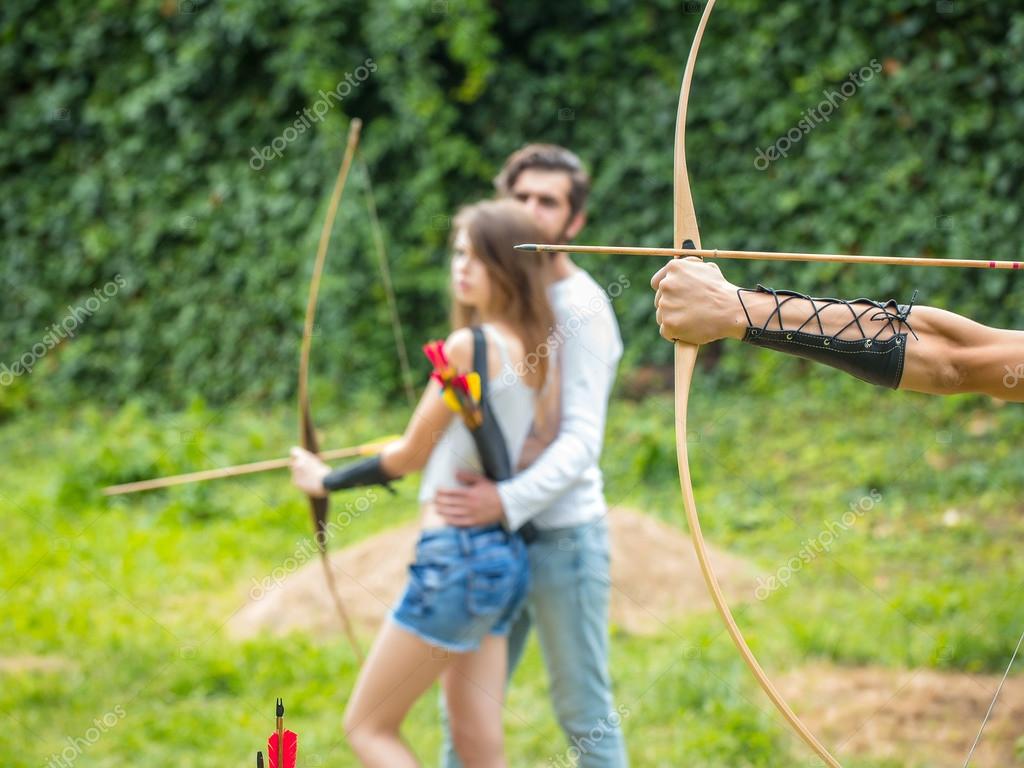 Young Naked Man Holding Bow Shooting Stock Photo