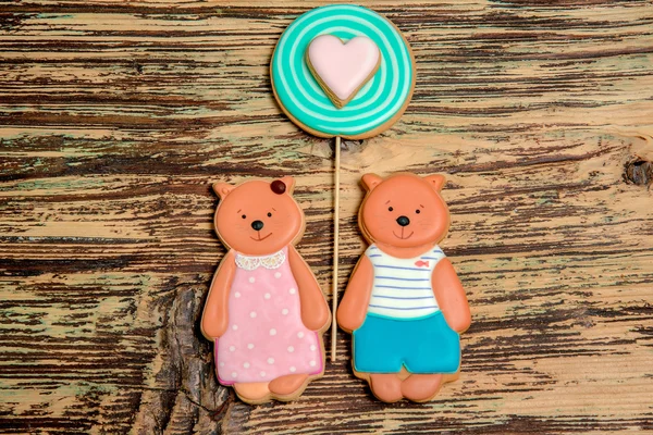colorful bear and heart cookies on wood