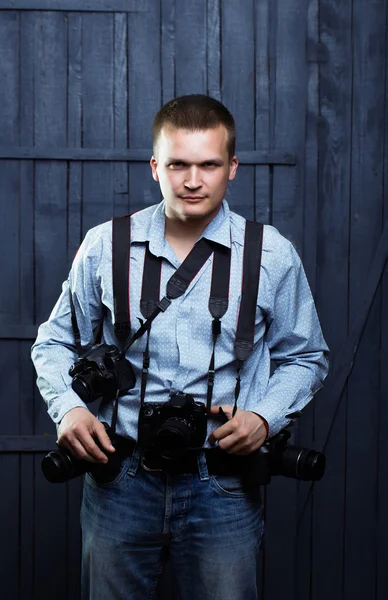 Photographer man with journalist cameras — Stock Photo, Image