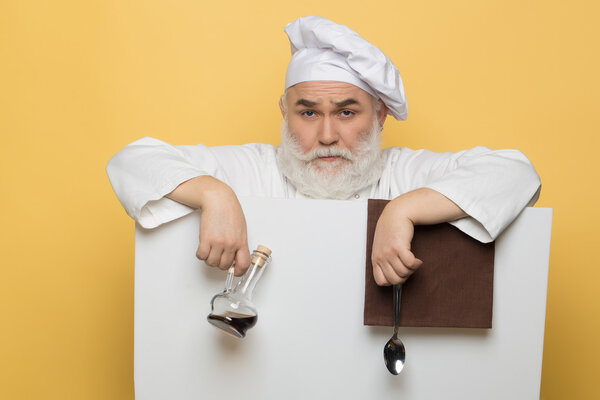 Bearded cook with paper