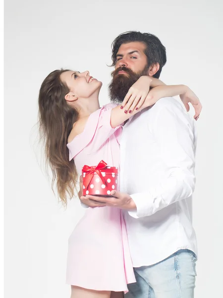 Young happy couple with box — Stock Photo, Image
