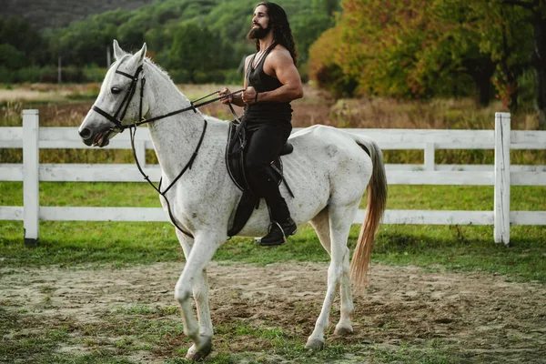 Young man on horse riding on horseback. — Stock Photo, Image