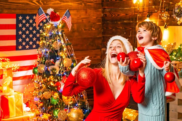 Happy family. Family holiday. Mom and kid decorating together christmas tree. Mother and son friendly having fun. Enjoy every moment together. Cozy evening at home. Family having fun at home — Stock Photo, Image