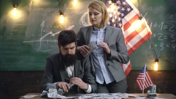 Businessman and Businesswoman with money. Portrait of success business people with money dollar bills banknotes. American couple Saving money. — Stock Video