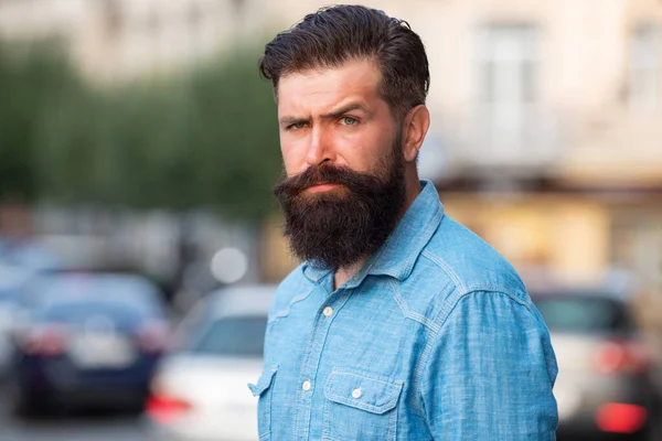 Handsome hipster modern businessman with beard walking in town. — Stock Photo, Image