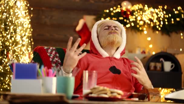 Portrait of funny Santa Claus with gifts at home near Christmas tree. New Year Holiday. — Stock Video