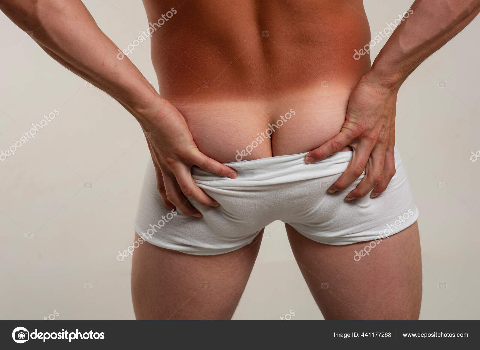 Man ass tan. Male underwear. Gay panties down. Sexy Mans naked butt  buttocks. Metrosexual concept. fotos, imagens de © Tverdohlib.com #441177268