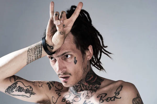 Horn sign. Handsome tattooed man. Men tattoo fashion. Brutal guy. — Stock Photo, Image