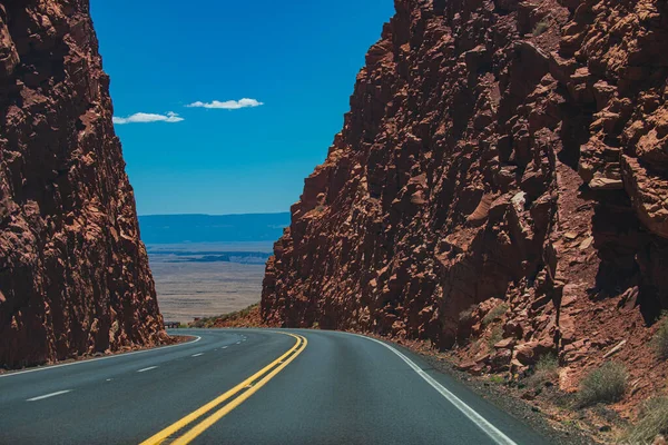 American road trip. Rural asphalt road among the rock mountain road. — Stock Photo, Image