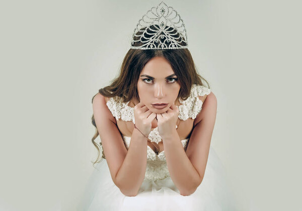 Woman queen. Beauty salon and wedding fashion. Haircare and prom queen. Woman with long hair white dress and crown.