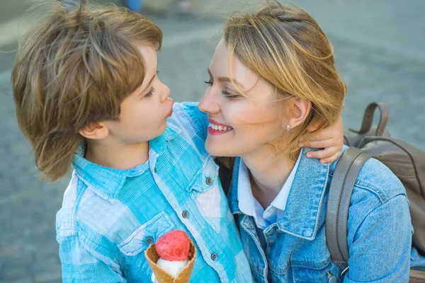 Motherhood. Child with mom eat icecream outdoor. Junk kids food. Delicious summer ice cream. — Stock Photo, Image