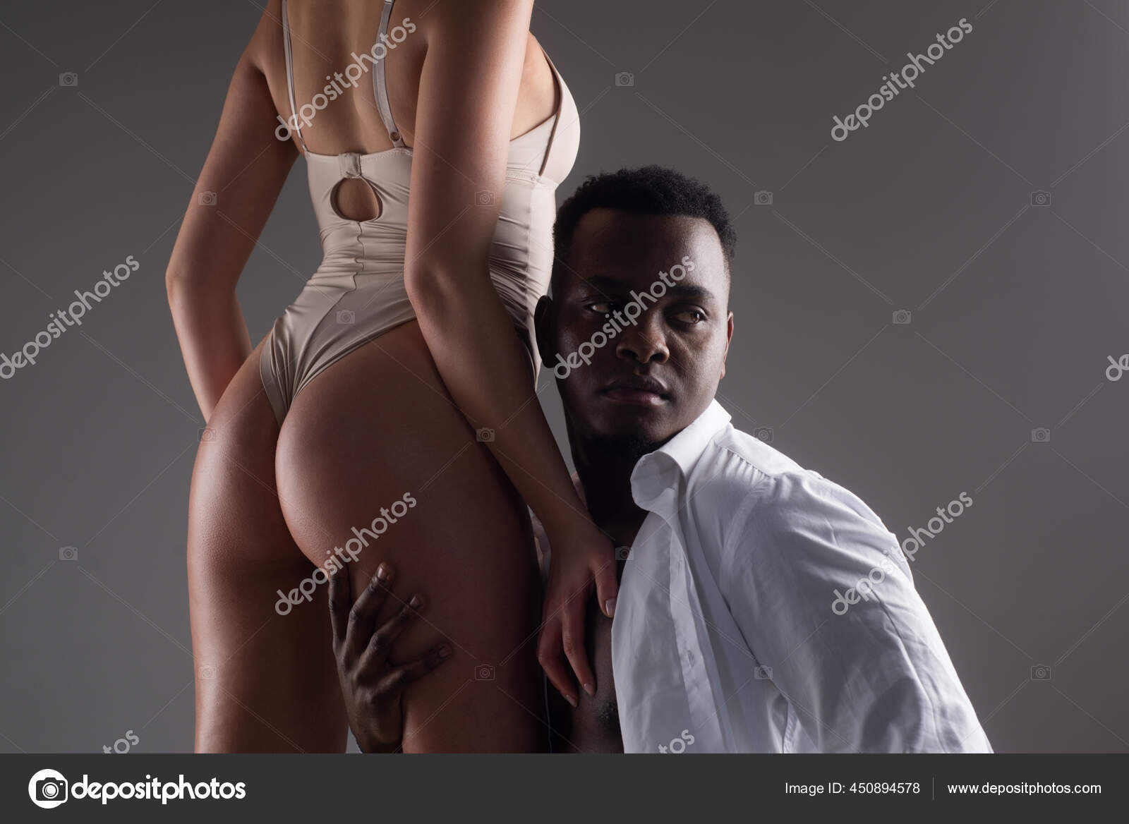 Multiethnic couple. Interracial sex. Passionately embracing. Sexy love. Erotic and desire. Couple relationships photo