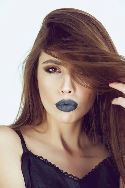 Fashion lips. Beauty model girl with black make up and long laches. Black lips, dark lipstick.