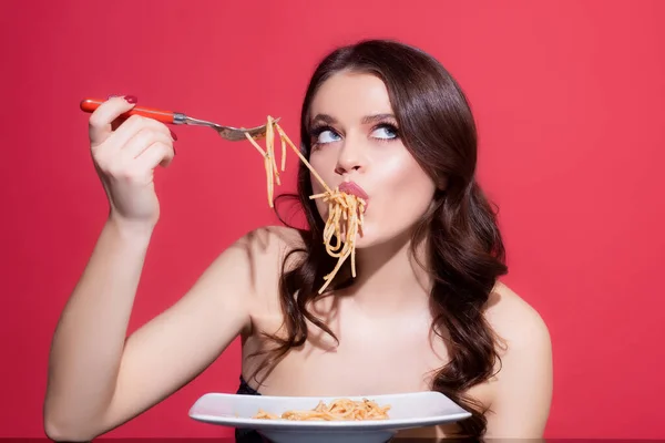 Italian cuisine concept. Healthy menu. Sexy woman eat tasty pasta. Food from Italia. Spaghetti.