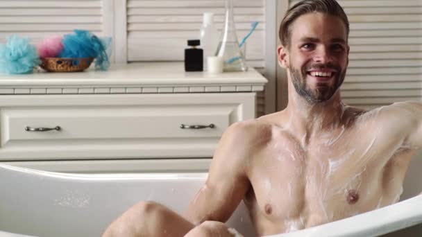 Man in bath. Bodycare. Handsome guy washes in shower. Naked male with wet body. Performing morning routine. — Wideo stockowe