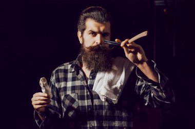 Bearded man gay. Modern man with classic long beard. Barber straight razor, barbershop. Shaving in barber shop. Mustache men.