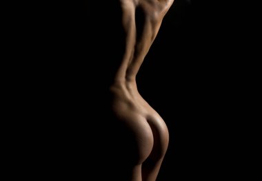 Sexy naked female buttocks of young woman with flexible nude body clipart