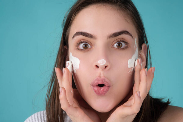 Beauty portrait of beautiful female model. Amazed surprised woman with beauty face, natural skin, facial skin portrait.