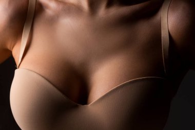 Women with large breasts. Sexy breas, boobs in bra, sensual tits. Beautiful slim female body. Lingerie model. Closeup of sexy female boob in bra.