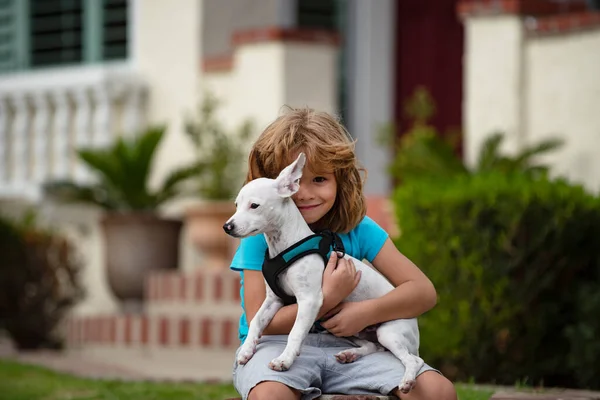 Kid boy hug puppy. Child with dog. Kid with puppy. Doggy lover. — Stock Photo, Image