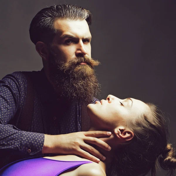 Man holds neck of woman. Couple of beautiful young woman and man. — Stock Photo, Image