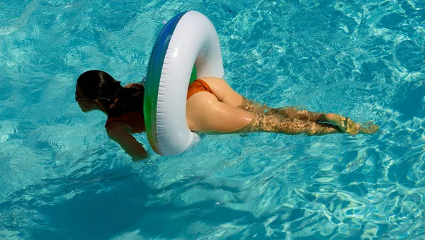 Summer vacation. Sexy woman in swimming pool. Female ass buttocks. Girl with swimming ring. — Stock Fotó