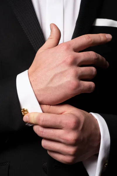 Man fixing cufflinks. Gentleman in black suit. Elegant and stylish clothes. Male fashion. Business look. — Stock Photo, Image