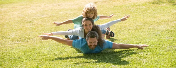 Cute family portrait. Mother father and child son having fun outdoors at summer park. Banner panorama with copy space for text. — Stock Photo, Image