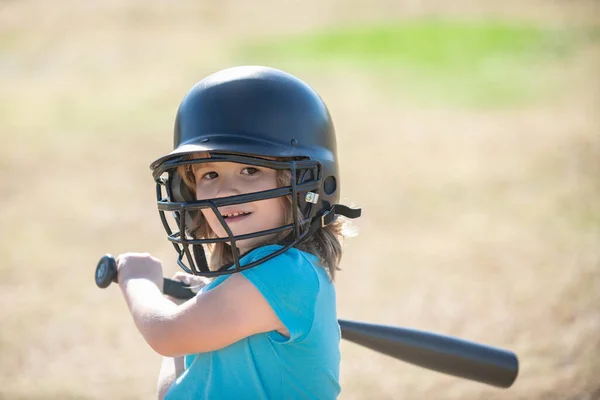 Baseball kid player in baseball helmet and baseball bat.