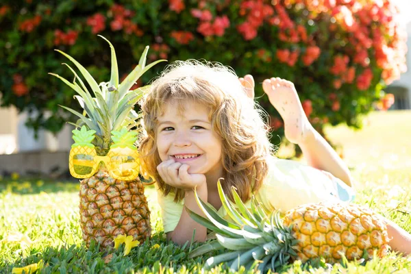 Funny boy with pineapple, close up kids face. — Stock Photo, Image
