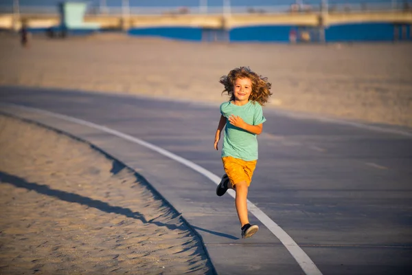 Cheerful child boy running to school. Kids run race. — Stock Photo, Image