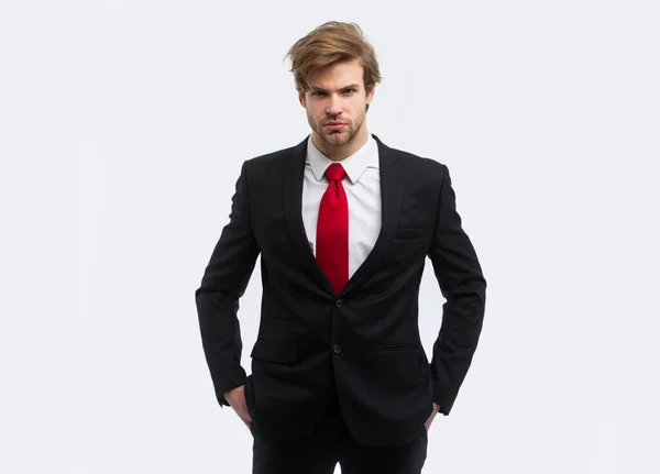 Man in formal suit with hands in pockets isolated over white background. — Stock Photo, Image