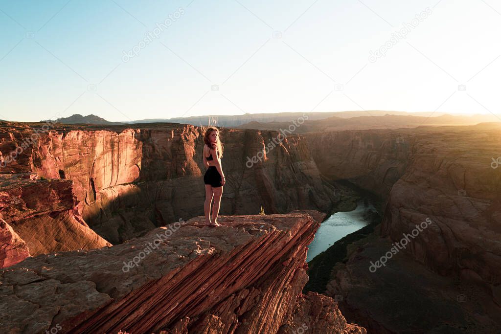 Carefree woman on Grand canyon. Panoramic Horeseshoe Bend. Woman enjoying view of Horseshoe bend, Arizona.