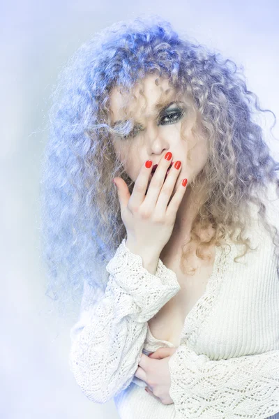 Very beautiful curly girl with red manicure — Stock Photo, Image