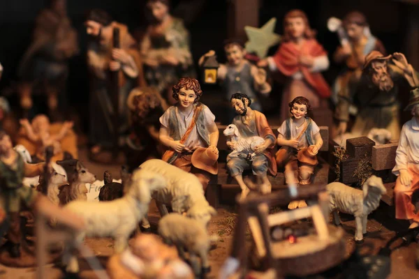 Christmas scene with figurines including sheep and shepherds — Stock Photo, Image