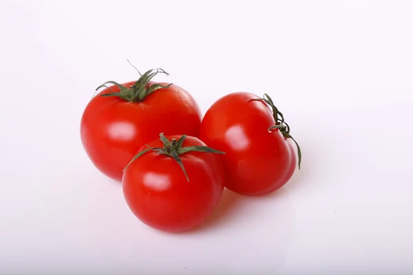 Three tomatoes   isolated on white — Stock Photo, Image