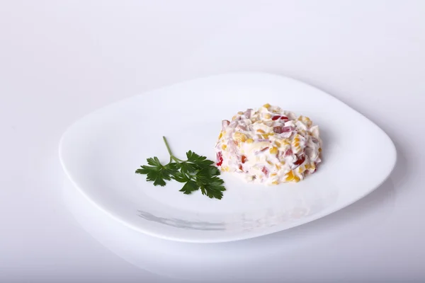 Salad on a white plate — Stock Photo, Image