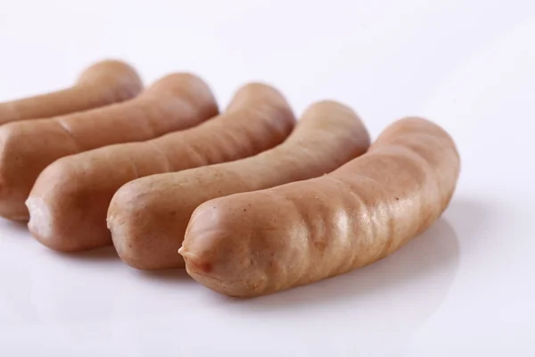 Delicious sausages with reflection — Stock Photo, Image