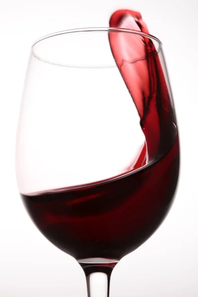 Red wine pouring into glass — Stock Photo, Image