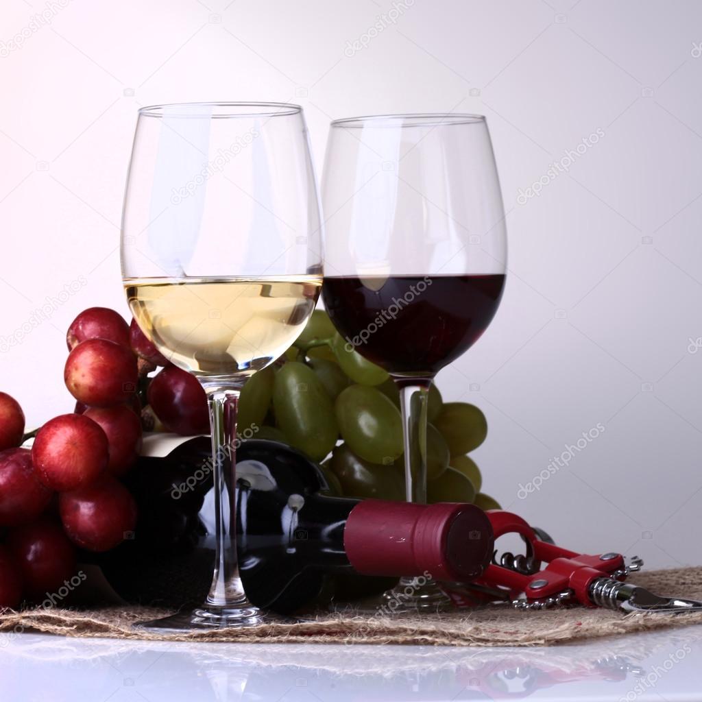 Wineglasses, bottle and grape