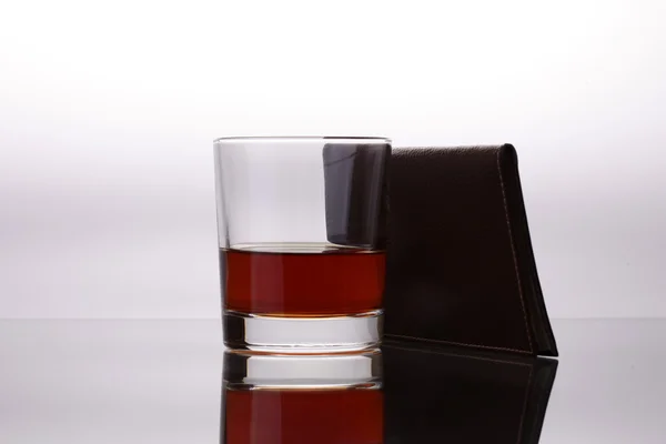 Glass of whiskey and a business card holder — Stock Photo, Image