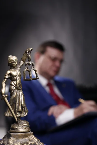 Femida statue and lawyer — Stock Photo, Image