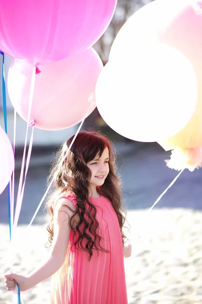 Pretty little girl with balloons outdoor — Stock Photo, Image