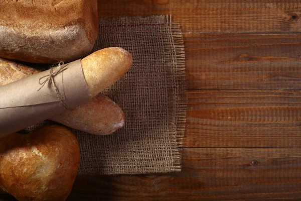 Loafs of white rye bread and baguette — Stock Photo, Image