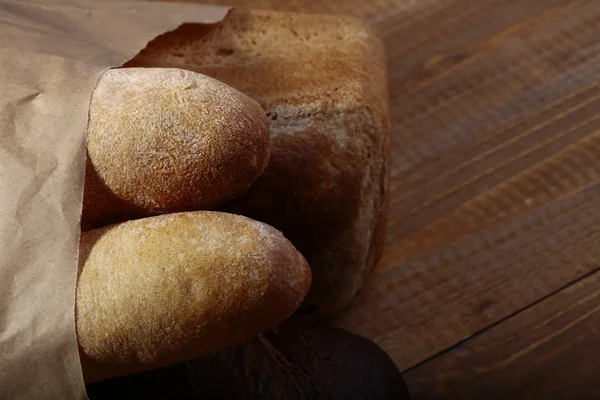 Loafs of bread in paper packet — Stock Photo, Image