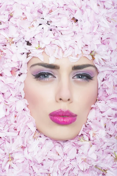 Face of girl in flowers