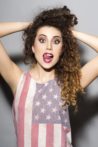 Crazy girl in american flag printed shirt — Stock Photo, Image