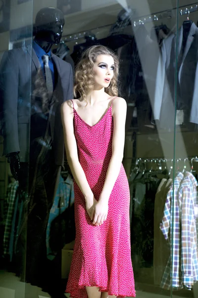 Sexy girl near shopping window — Stock Photo, Image