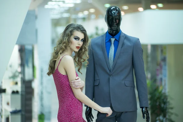 Alluring girl and mannequin — Stock Photo, Image